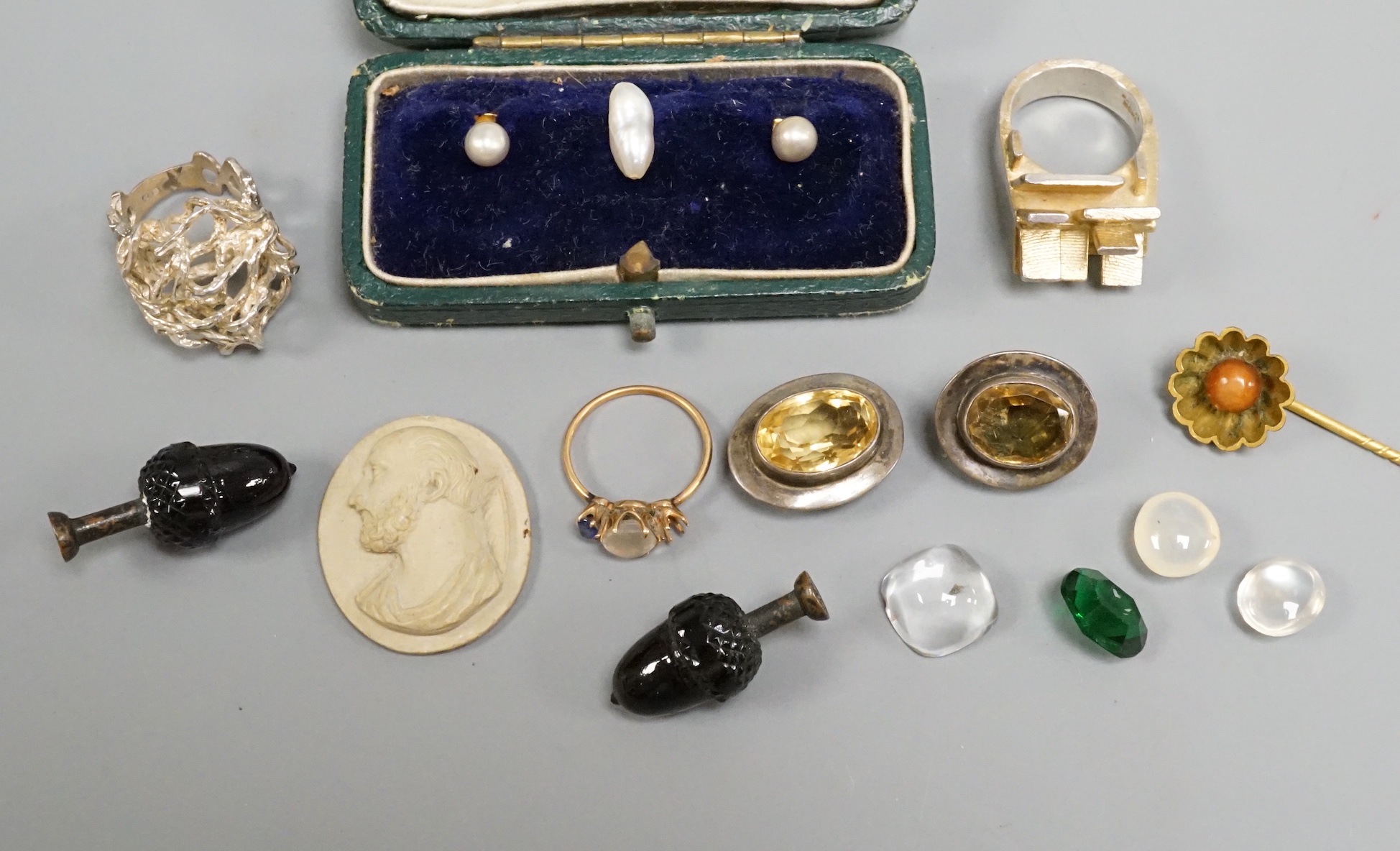 A small group of jewellery and curios including a Scandinavian sterling modernist ring, one other white metal modern ring, a lava cameo dress stud set etc.